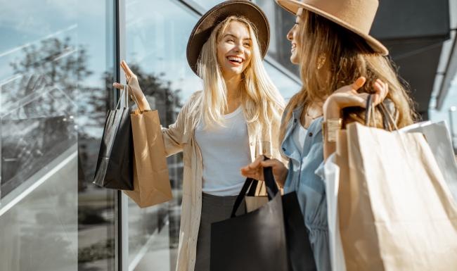 a few women carrying shopping bags